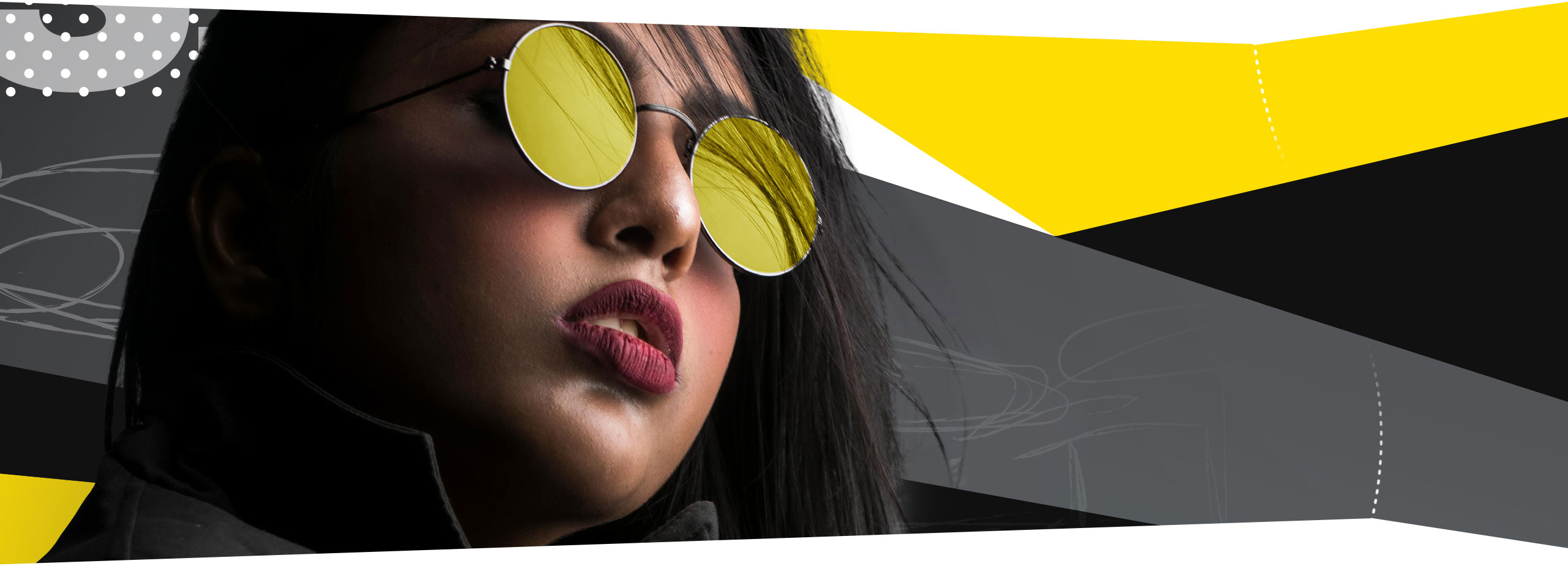 a section divider image of a woman wearing sunglasses on a yellow background